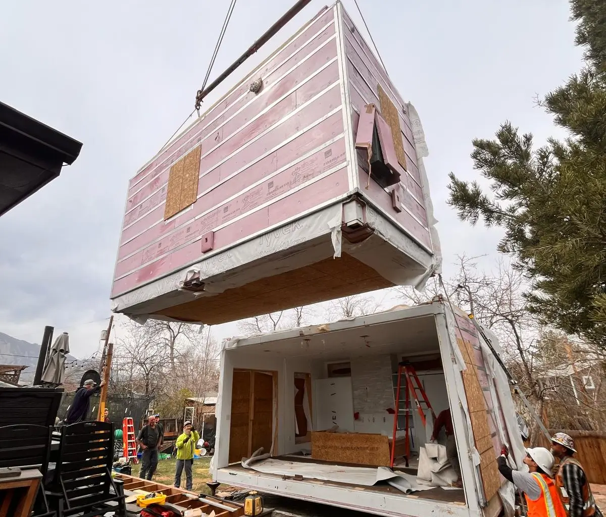 A crane lowering a Flex-Flat module into place on install day